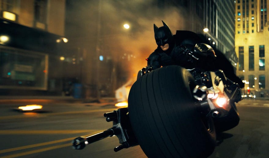 Still image from The Dark Knight featuring Batman on his motorcycle