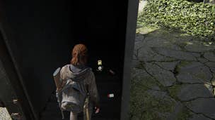 Ellie collecting a training manual from a shipping container in The Last of Us Part 2 Remastered on PS5