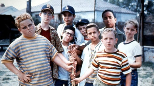 Photograph of the cast of the Sandlot in character, holding a bat