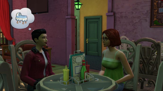 Two Sims sitting together in a bar, discussing having babies (represented by a bassinet icon).
