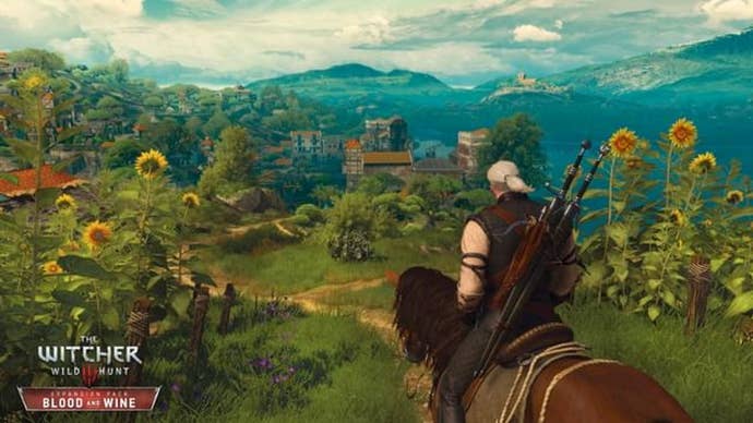 Witcher 3 Grandmaster Feline Equip Location: A white-haired man with a ponytail sits on a brown horse.They are on a hill overlooking a field of sunflowers with mountains in the distance