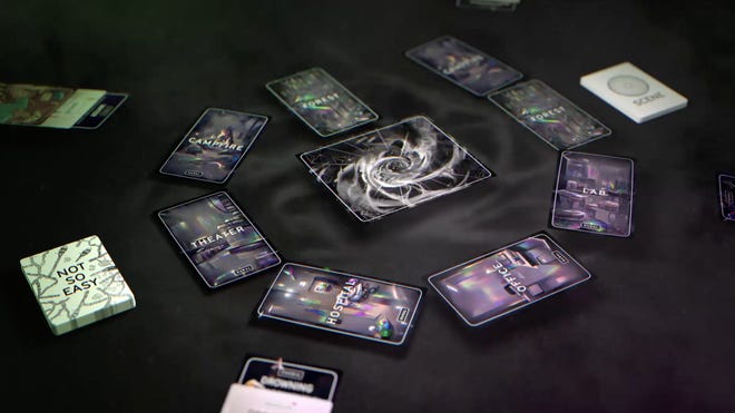 Tabletop RPG The Zone set up on a table, showing off its spiral card pattern built during play.