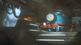 Thomas the Tank Engine stands at the top of a staircase in a dark, gloomy, space station. A flashlight shining on Thomas makes him stand out from the dark background.