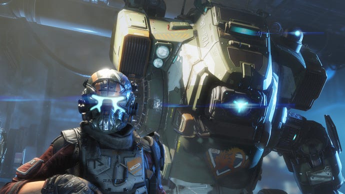 A soldier stands next to a mech in Titanfall 2