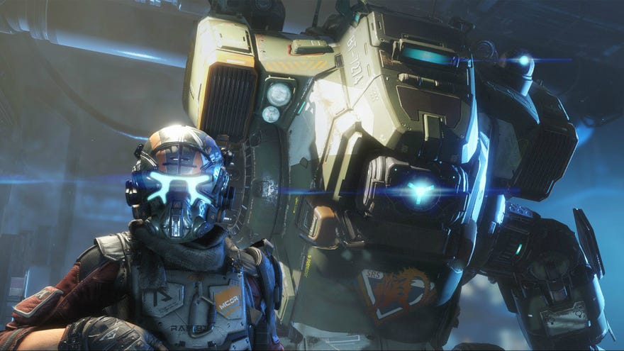 An armoured soldier stands in front of a mech in Titanfall 2