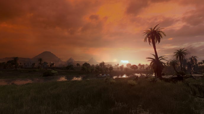A shot of a sunset behind palm trees in Total War: Pharaoh