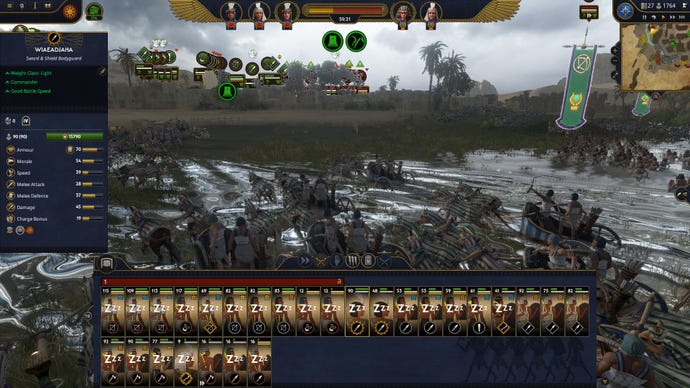 A parade of chariots charge into battle in Total War: Pharaoh.