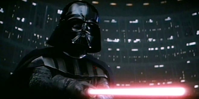 Darth Vader wielding his red lightsaber
