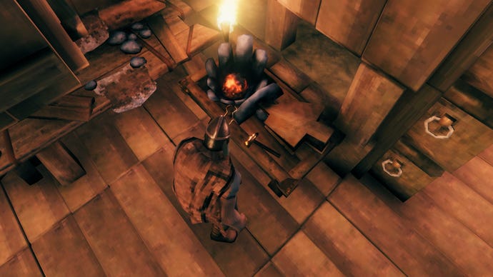 Скриншот Valheim с кузницей, помещенным в дом, и игрок смотрит на нее вниз