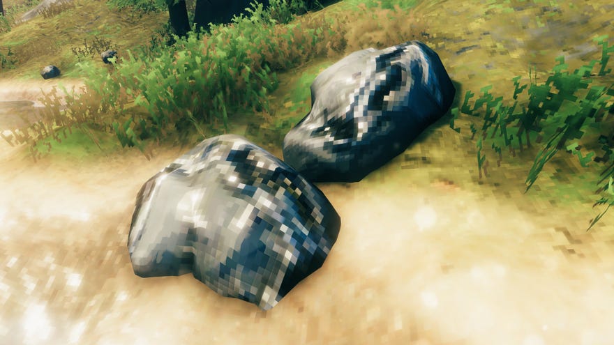 A Valheim screenshot of a pair of Tin Ore deposits close together next to the water.