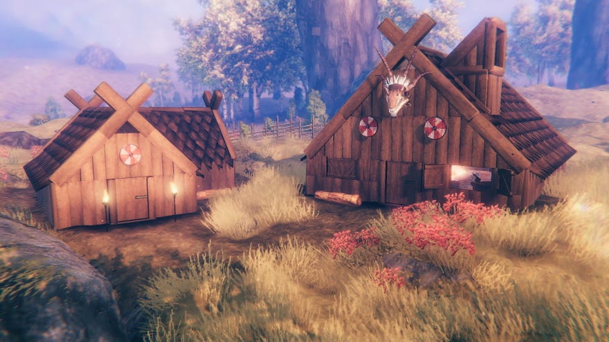 Two houses in Valheim's Hearth & Home update, outfitted with Darkwood roofs and window hatches.