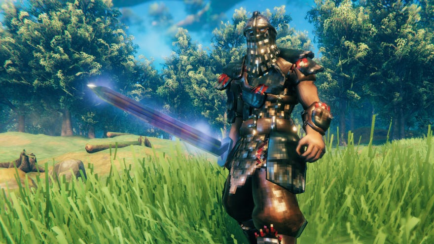 A player in Valheim, clad in Carapace Armour, wields the Mistwalker Sword while standing in a Meadows field.