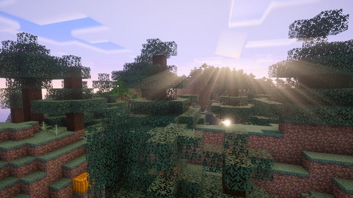 The sun rises over a hilly Minecraft forest.