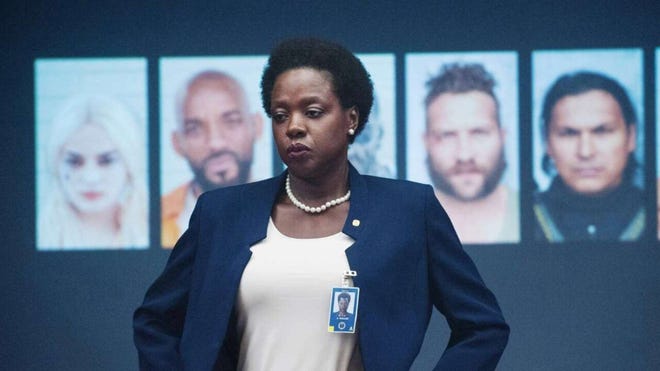 Amanda Waller stands in front of Task Force X