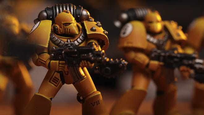 A close-up of Space Marine miniatures from the Warhammer: The Horus Heresy - Age of Darkness boxed set