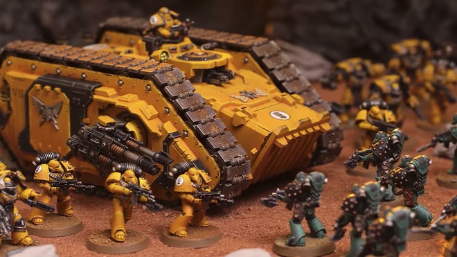A close-up of Space Marine miniatures from the Warhammer: The Horus Heresy - Age of Darkness boxed set