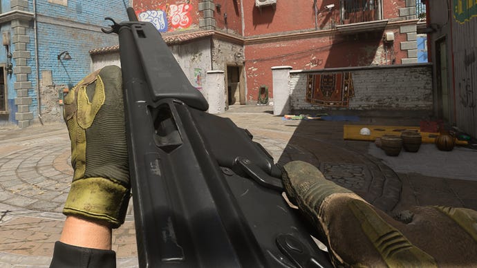 The player in Warzone 2.0 inspects their weapon, the LM-S.
