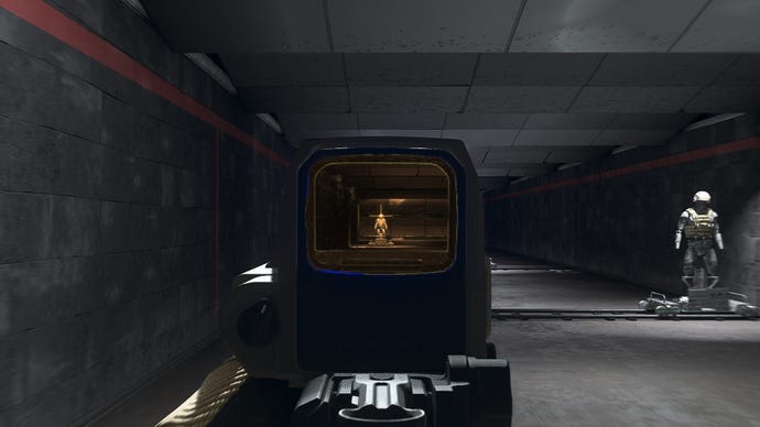 The player in Warzone 2.0 aims at a training dummy using the SZ Holotherm optic attachment.