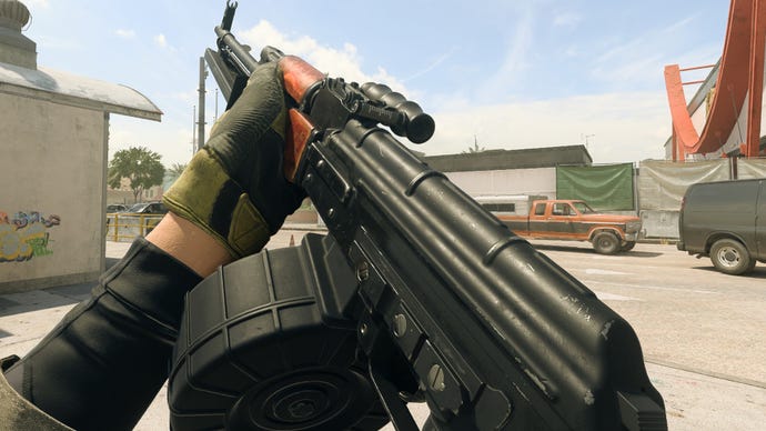 The player in Warzone 2.0 inspects their weapon, the RPK.