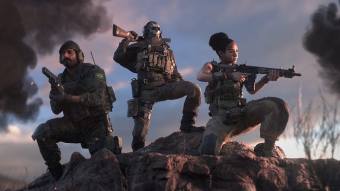 Three soldiers in Warzone 2.0 crouch atop a hill and pose in front of the camera.