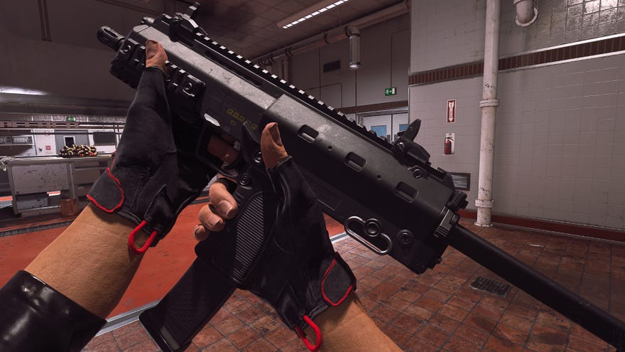 The player in Warzone 2.0 inspects their weapon, the VEL 46.