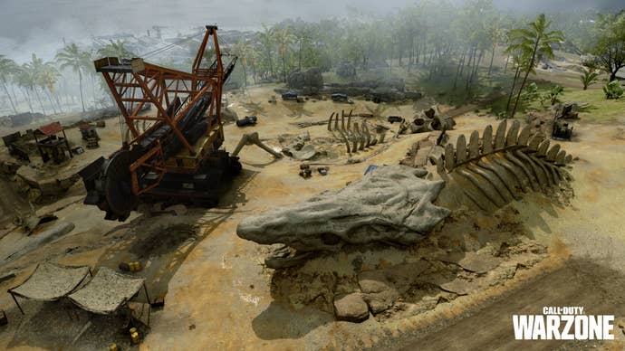 An aerial shot of a massive dig site, with giant monster skeletons uncovered.