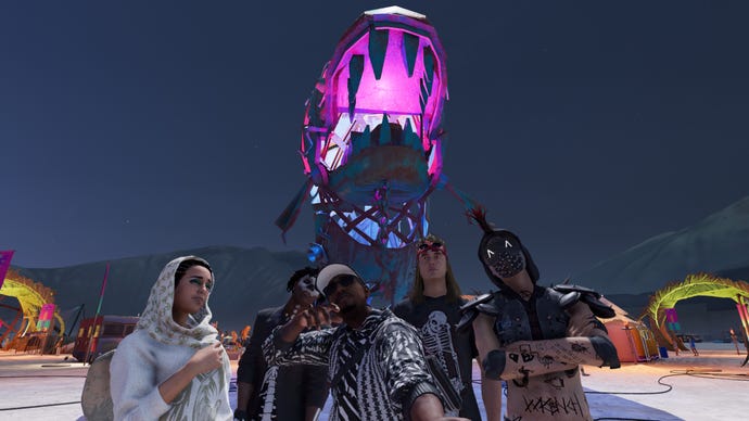 The DedSec gang pose for a selfie at a Burning Man-style event in a Watch Dogs 2 screenshot.