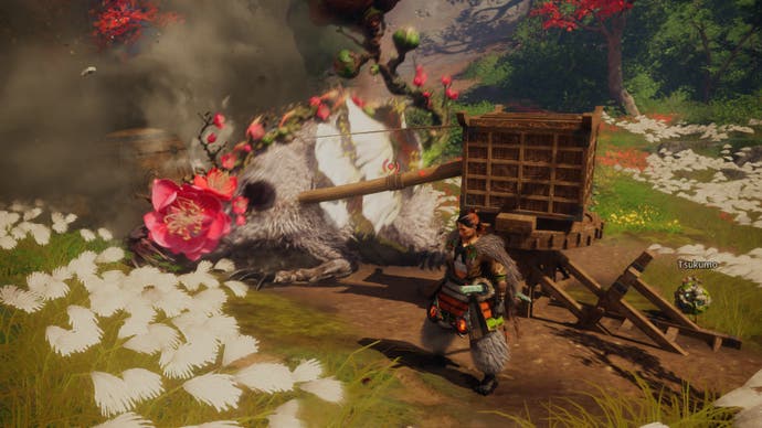 Wild Hearts Review - Der Spielercharakter steht neben einem gefälschten rattenähnlichen Monster mit grauem Fell und einer großen hölzernen Voraussetzung, um es anzugreifen