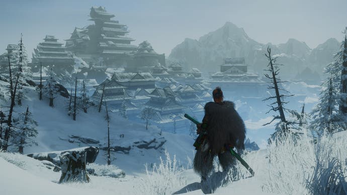Wild Hearts Review - Der Spielercharakter blickt über schneebedeckte Landschaften und eine Pyramide von Gebäuden auf
