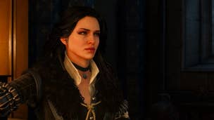 The Witcher 3 romance: A white woman with long black hair stands near a wood panel wall, illuminated by firelight. She's wearing a high white collar and a black leather jerkin