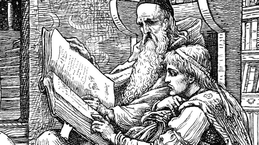 An old man sitting in an armchair holds a large book from which he reads with a younger man kneeling at his side