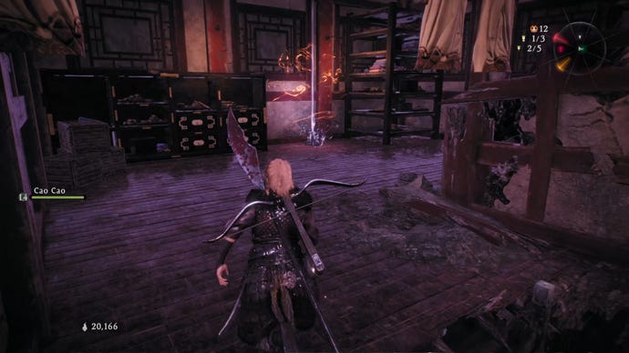 A Wo Long: Fallen Dynasty screenshot of the player standing next to a flag.