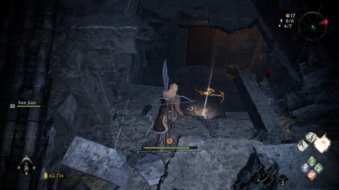 A Wo Long: Fallen Dynasty screenshot of the player standing next to a flag.