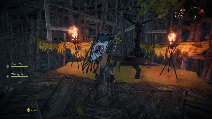 A Wo Long: Fallen Dynasty screenshot of the player standing next to a flag.