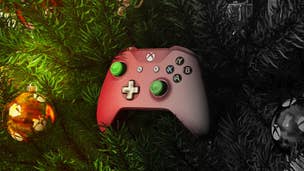 A green and red Xbox controller sits in a Christmas tree, all colours fading away as it moves across the image.