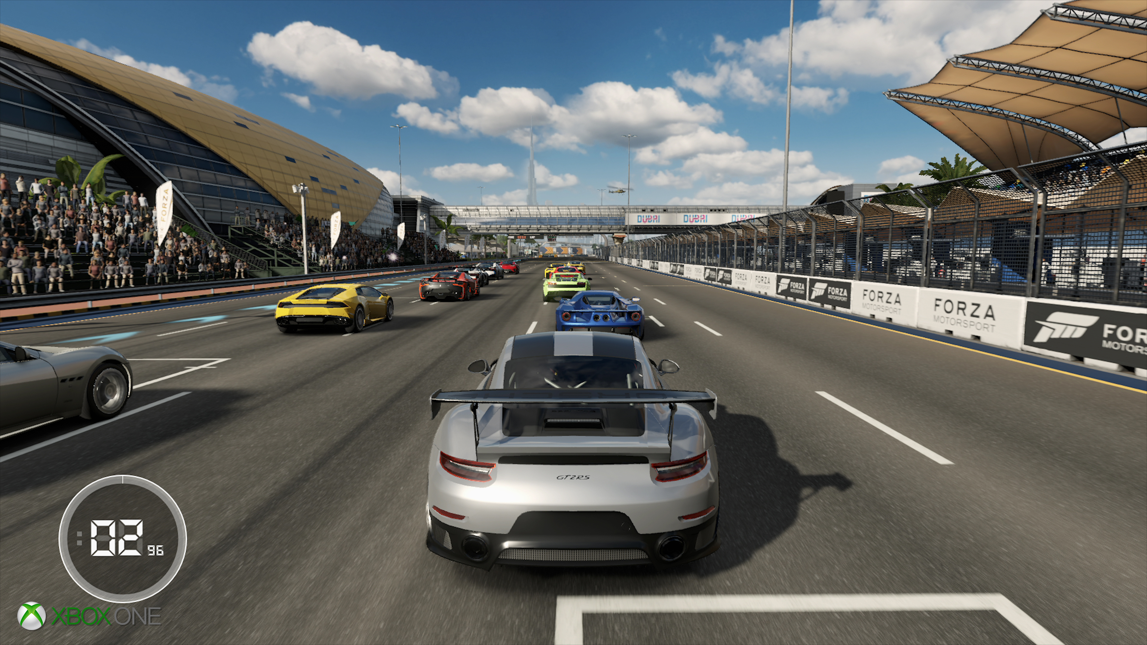 How does Forza 7 improve on Xbox One X over base hardware?