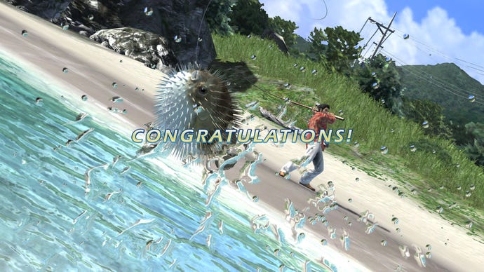 Kiryu hooks in a puffer fish off the shores of Okinawa, with "congratulations!" signalling his success, in Yakuza 3 Remastered.