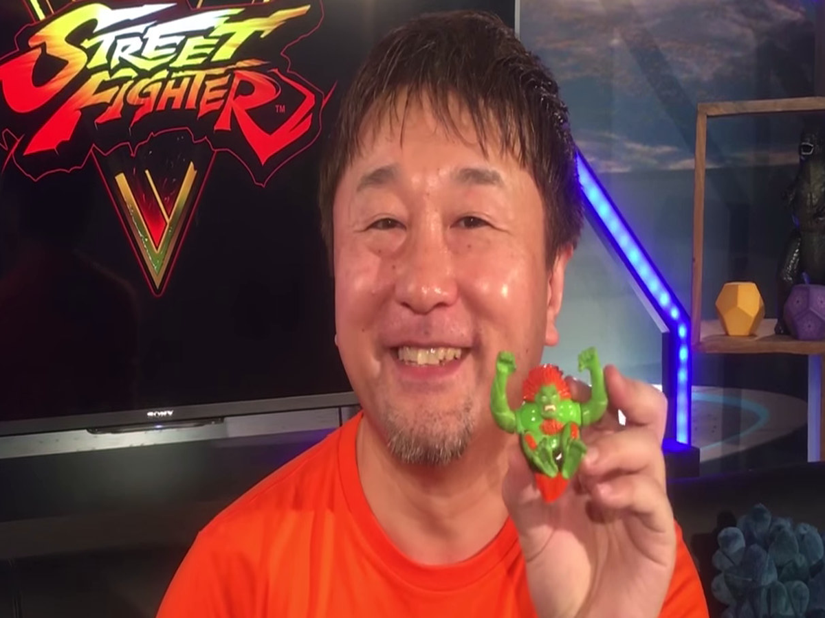 Yoshinori Ono tells the origin story of his Blanka toy that came from a  burger place in the Philippines revealing he wasn't a fan of the green  fighter