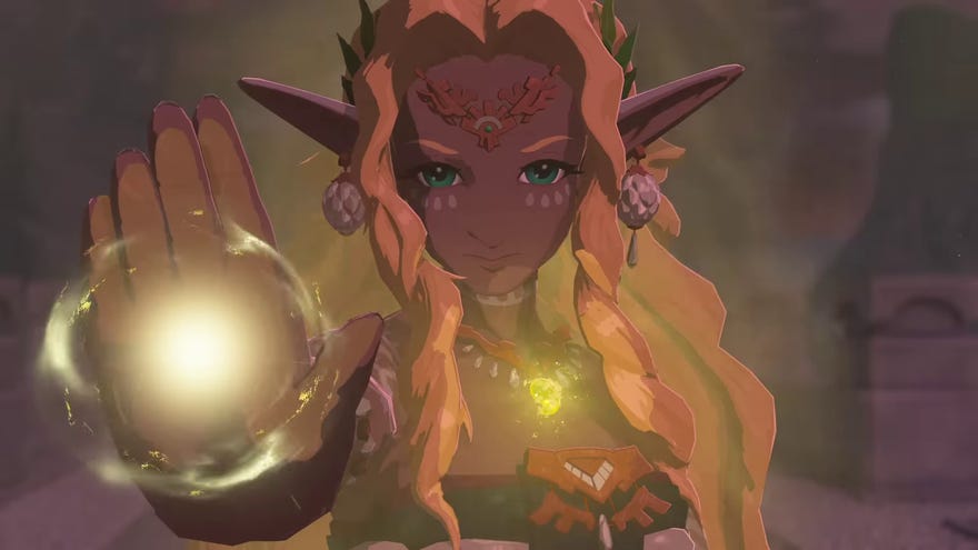 A blonde elfin woman raises her hand and emits a gold magic light from it, as she stares at the camera, in The Legend Of Zelda: Tears Of The Kingdom