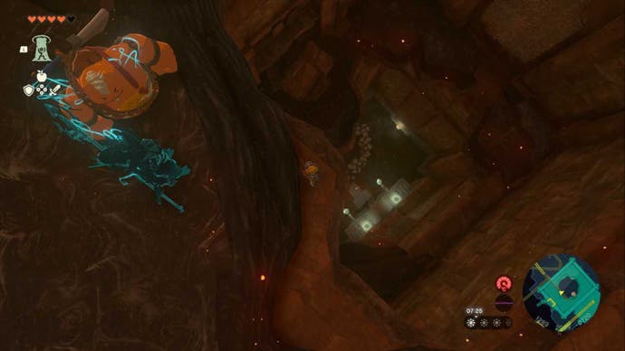 Zelda TOTK, Link Sidon and Yunobo are all looking down a big hole in the Fire Temple.