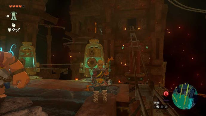 Zelda TOTK Fire Temple, Link is looking at a cart track that is raised up, leading to a higher area.