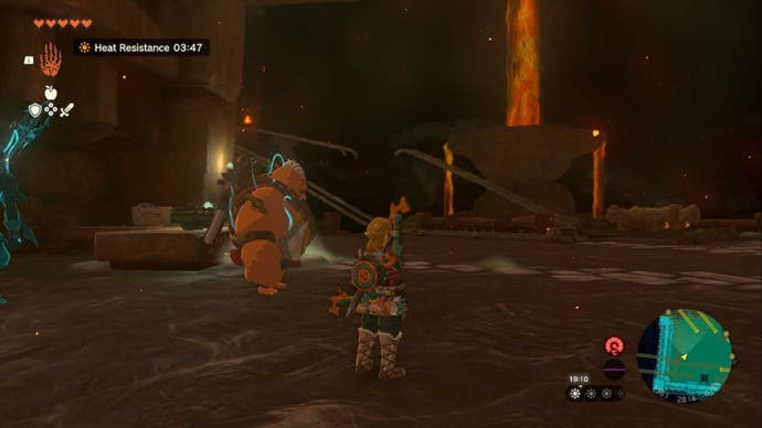 Zelda TOTK, Link and Yunobo are in the Fire Temple, looking at a pair of broken tracks on their left.