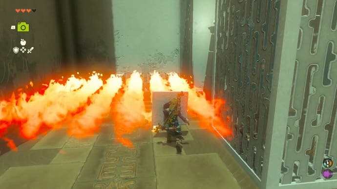 Zelda Tears of the Kingdom, Link holds a stone shield to block the fire as he enters it into Ijo-o Shrine.