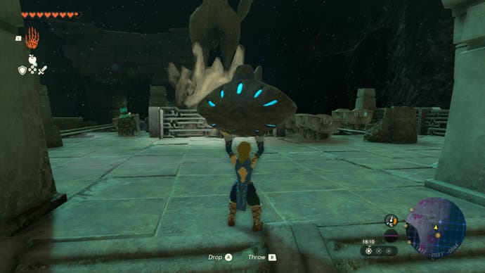 Zelda Totk Link mit Blick auf die Statue- und Rails -Gebiet in den Tiefen
