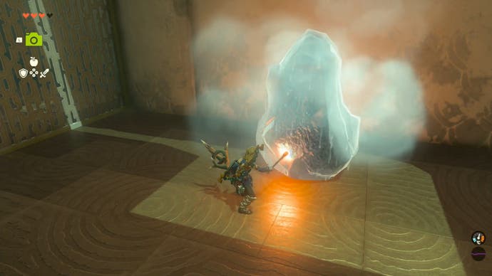 Zelda Tears of the Kingdom, Link using a Torch to melt the ice around a chest in the Ijo-o Shrine