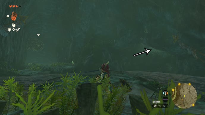Link exploring the Upland Zorana Byroad cave with an arrow pointing in the direction that players need to head.